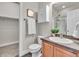 Bathroom featuring a vanity with ample cabinet space and a shower with sliding glass doors at 3372 Central Park Blvd, Denver, CO 80238