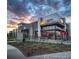 Attractive commercial building at dusk; ideal location for dining and retail businesses at 3372 Central Park Blvd, Denver, CO 80238