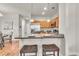 Bright kitchen features stainless appliances, pendant lighting, and a breakfast bar with seating at 3372 Central Park Blvd, Denver, CO 80238