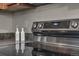Detailed shot of a stovetop with black tile backsplash and modern stainless steel appliances at 3372 Central Park Blvd, Denver, CO 80238