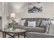 Close-up of a gray sofa set with decorative pillows and a coffee table in a bright living room at 3372 Central Park Blvd, Denver, CO 80238