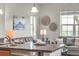 A cozy view from the kitchen's breakfast bar into the living room with an upscale gray sofa at 3372 Central Park Blvd, Denver, CO 80238