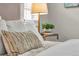 Close up of a nicely decorated main bedroom showing bed and side table at 3372 Central Park Blvd, Denver, CO 80238