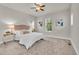 Spacious main bedroom offers plush carpet, natural light, and a ceiling fan at 3372 Central Park Blvd, Denver, CO 80238