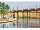 Scenic pond view with covered seating area; perfect place to relax and enjoy the outdoors at 3372 Central Park Blvd, Denver, CO 80238