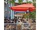 Outdoor restaurant patio with vibrant umbrellas, offering a lively dining experience at 3372 Central Park Blvd, Denver, CO 80238