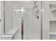 Modern walk-in shower with sleek glass doors, bench seating, and tile surround at 3372 Central Park Blvd, Denver, CO 80238