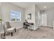 Cozy sitting room features neutral color palette and large window for natural light at 3372 Central Park Blvd, Denver, CO 80238
