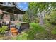 Spacious back yard with patio, seating, and shade trees; outdoor living at its finest at 10 Cherry St, Denver, CO 80220