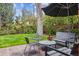 Relaxing backyard patio with seating under a large umbrella and tree at 10 Cherry St, Denver, CO 80220