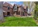 Large backyard with patio, seating area, and lush green lawn; a perfect outdoor space at 10 Cherry St, Denver, CO 80220