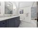 Bathroom featuring a large vanity with a marble countertop and a tiled shower at 10 Cherry St, Denver, CO 80220
