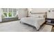 Cozy bedroom featuring a window seat with natural light and a comfortable bed with neutral decor at 10 Cherry St, Denver, CO 80220