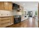 Spacious kitchen with custom cabinets, marble counters, and stainless steel appliances at 10 Cherry St, Denver, CO 80220