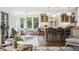 Open living space features hardwood floors, breakfast nook, and seamless access to kitchen at 10 Cherry St, Denver, CO 80220