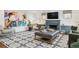 Stylish living room featuring modern decor, fireplace, and custom built-in cabinets at 10 Cherry St, Denver, CO 80220