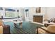 Bright living room with large windows, marble fireplace and patterned rug at 10 Cherry St, Denver, CO 80220