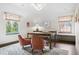 Office featuring a large desk, two plush chairs, and a built-in window seat at 10 Cherry St, Denver, CO 80220