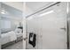 Bathroom with a walk-in shower and neutral tile at 45008 Sunflower Ln, Bennett, CO 80102