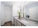 Elegant bathroom with double vanity and granite countertop at 45008 Sunflower Ln, Bennett, CO 80102