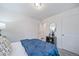 Bedroom with a double closet and window at 45008 Sunflower Ln, Bennett, CO 80102