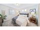 Bright bedroom with window, neutral decor, and a window seat at 45008 Sunflower Ln, Bennett, CO 80102