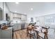 Modern kitchen with gray cabinets, granite countertops and stainless steel appliances at 45008 Sunflower Ln, Bennett, CO 80102