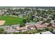 Aerial view of a cozy home near lush green parks, baseball field, and tennis courts in a Gathering-friendly neighborhood at 235 N 12Th Ave, Brighton, CO 80601