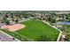 A bird's-eye view of a house near a sprawling baseball field and park, offering ample recreation space at 235 N 12Th Ave, Brighton, CO 80601
