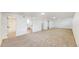 Spacious basement featuring neutral carpet, white trim and access to additional rooms at 235 N 12Th Ave, Brighton, CO 80601
