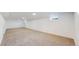 Large carpeted basement with white walls and recessed lighting provides flexible living space at 235 N 12Th Ave, Brighton, CO 80601
