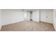 Finished basement boasts soft carpet and leads to areas including storage and utility rooms at 235 N 12Th Ave, Brighton, CO 80601