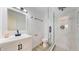 Modern bathroom features a glass-enclosed shower and updated vanity at 235 N 12Th Ave, Brighton, CO 80601