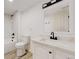 Modern bathroom featuring tile shower, sleek vanity, and contemporary fixtures at 235 N 12Th Ave, Brighton, CO 80601