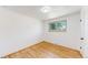 Bright bedroom with hardwood floors and a window offering natural light at 235 N 12Th Ave, Brighton, CO 80601