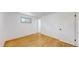 Bright bedroom featuring hardwood floors and closet at 235 N 12Th Ave, Brighton, CO 80601