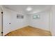 Bedroom with hardwood floors and two windows providing natural light at 235 N 12Th Ave, Brighton, CO 80601