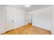 Bedroom featuring hardwood floors, a window, and a closet at 235 N 12Th Ave, Brighton, CO 80601