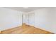Bedroom with hardwood floors, closet, and an ensuite bathroom at 235 N 12Th Ave, Brighton, CO 80601
