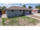 Charming single-story home featuring a well-maintained lawn and an attached garage in a desirable neighborhood at 235 N 12Th Ave, Brighton, CO 80601