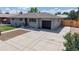 Charming single-story home with an attached garage and well-maintained landscaping at 235 N 12Th Ave, Brighton, CO 80601