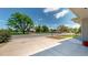 Expansive front yard view showcasing a neighborhood park with mature trees and a sidewalk at 235 N 12Th Ave, Brighton, CO 80601