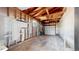 Exposed studs in garage offers storage and parking. Needs TLC at 235 N 12Th Ave, Brighton, CO 80601