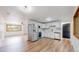 Updated kitchen with stainless steel appliances, white cabinets, and modern backsplash at 235 N 12Th Ave, Brighton, CO 80601