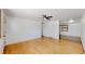 Bright and airy living room with hardwood floors, white walls, and a modern ceiling fan at 235 N 12Th Ave, Brighton, CO 80601