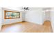 Inviting living room featuring hardwood floors, a large window, and neutral paint at 235 N 12Th Ave, Brighton, CO 80601