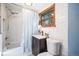 Charming bathroom features modern tile work, vanity, bathtub, and a window for natural light at 5672 Santa Clara Rd, Indian Hills, CO 80454