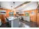 Well-lit kitchen with stainless steel appliances, granite countertops, and a breakfast bar with seating at 5672 Santa Clara Rd, Indian Hills, CO 80454