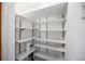 A walk-in pantry with adjustable shelving and ample storage space for groceries and household items at 5672 Santa Clara Rd, Indian Hills, CO 80454