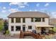 Backyard with deck, patio, bbq and stairs to the living areas at 7141 Red Mesa Dr, Littleton, CO 80125